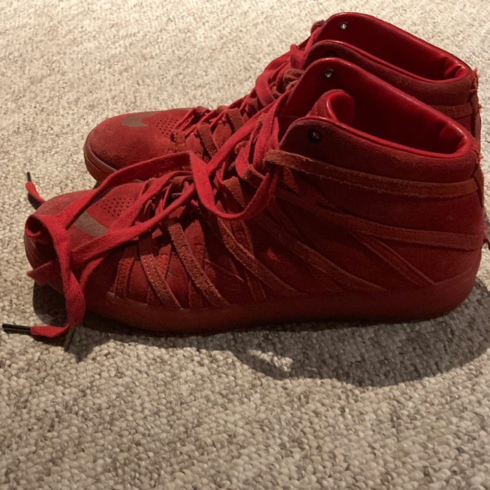 Red high top Nikes.